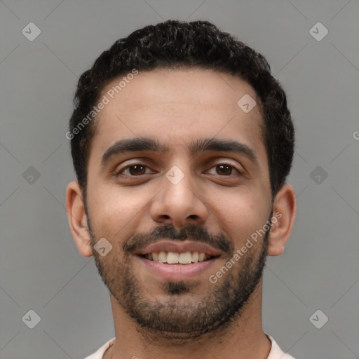 Joyful latino young-adult male with short  black hair and brown eyes