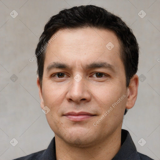 Joyful white adult male with short  brown hair and brown eyes