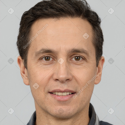 Joyful white adult male with short  brown hair and brown eyes