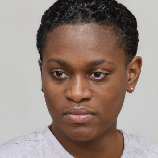 Neutral black young-adult female with short  black hair and brown eyes