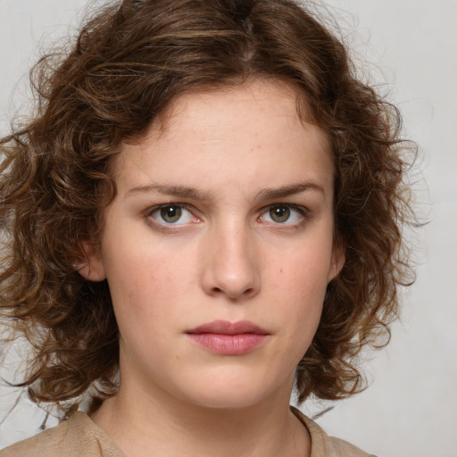 Neutral white young-adult female with medium  brown hair and green eyes