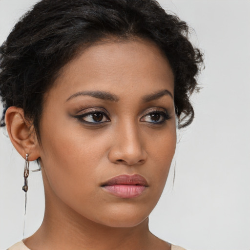 Neutral latino young-adult female with long  brown hair and brown eyes