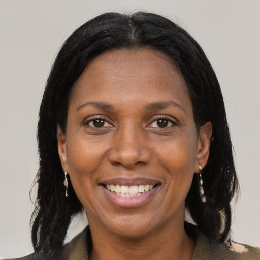 Joyful black adult female with medium  black hair and brown eyes