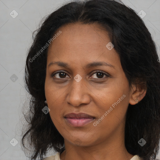 Joyful black adult female with medium  brown hair and brown eyes