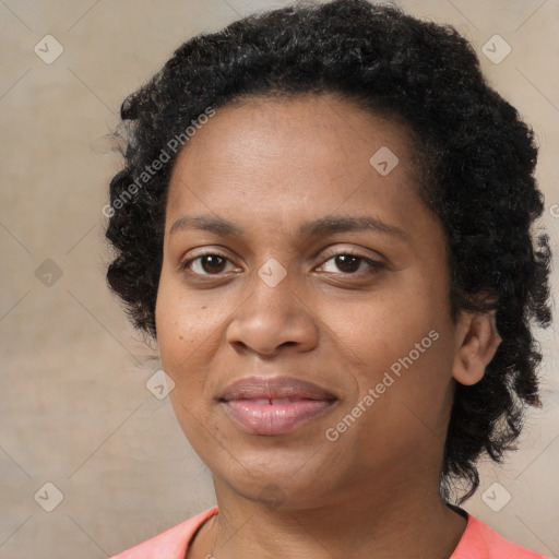 Joyful black adult female with medium  brown hair and brown eyes