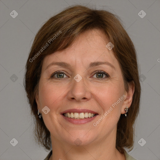 Joyful white adult female with medium  brown hair and grey eyes