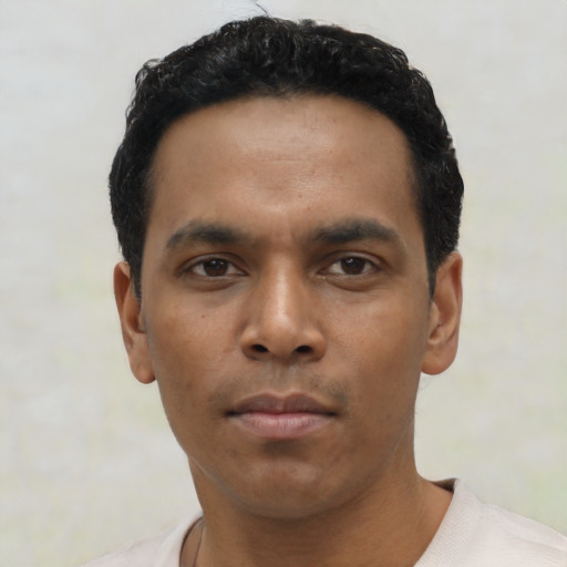 Neutral latino young-adult male with short  black hair and brown eyes