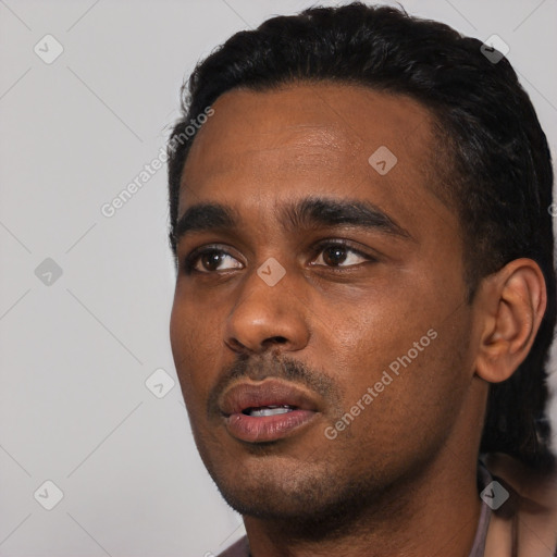 Neutral black young-adult male with short  black hair and brown eyes