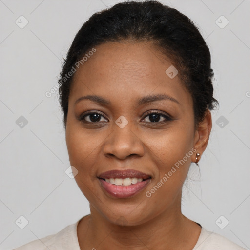 Joyful black young-adult female with short  brown hair and brown eyes