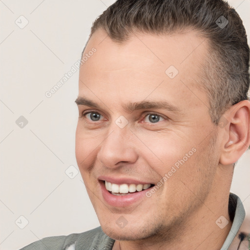 Joyful white adult male with short  brown hair and brown eyes