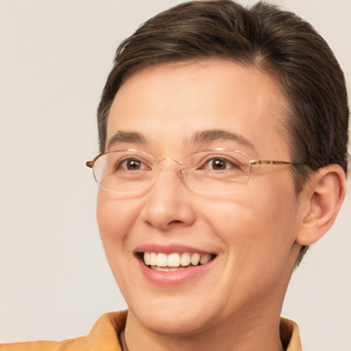 Joyful white adult female with short  brown hair and brown eyes