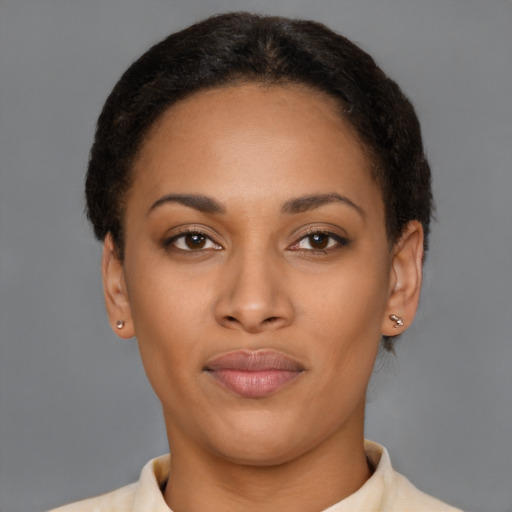 Joyful latino young-adult female with short  brown hair and brown eyes