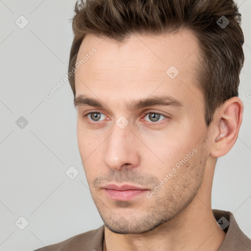 Neutral white young-adult male with short  brown hair and grey eyes