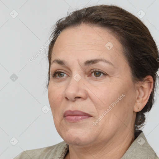 Joyful white adult female with medium  brown hair and brown eyes