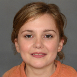 Joyful white young-adult female with medium  brown hair and blue eyes