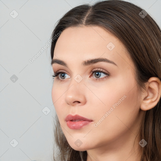 Neutral white young-adult female with long  brown hair and brown eyes