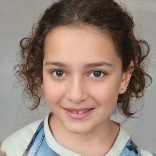 Joyful white child female with medium  brown hair and brown eyes