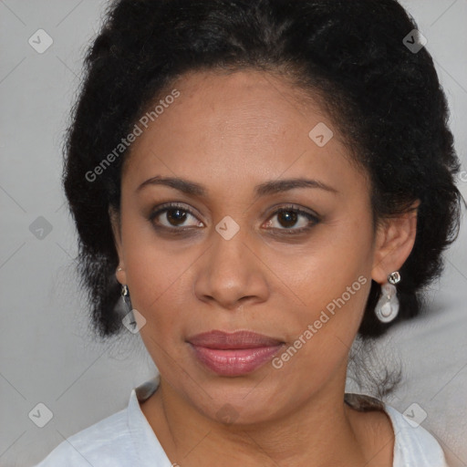 Joyful black adult female with medium  brown hair and brown eyes