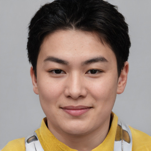 Joyful asian young-adult female with short  brown hair and brown eyes
