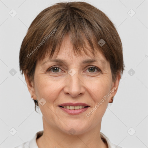 Joyful white adult female with short  brown hair and brown eyes