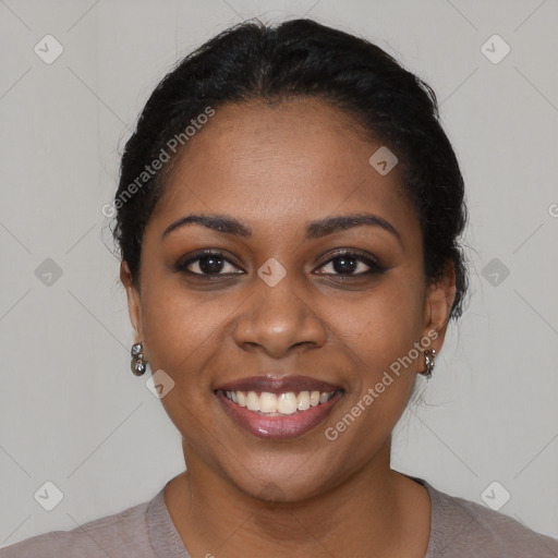 Joyful black young-adult female with short  black hair and brown eyes