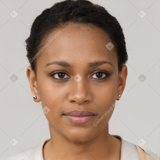 Joyful black young-adult female with short  brown hair and brown eyes