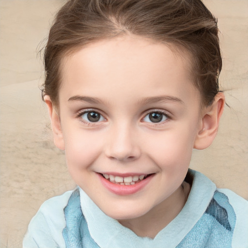 Joyful white child female with short  brown hair and brown eyes