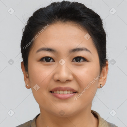 Joyful asian young-adult female with short  brown hair and brown eyes