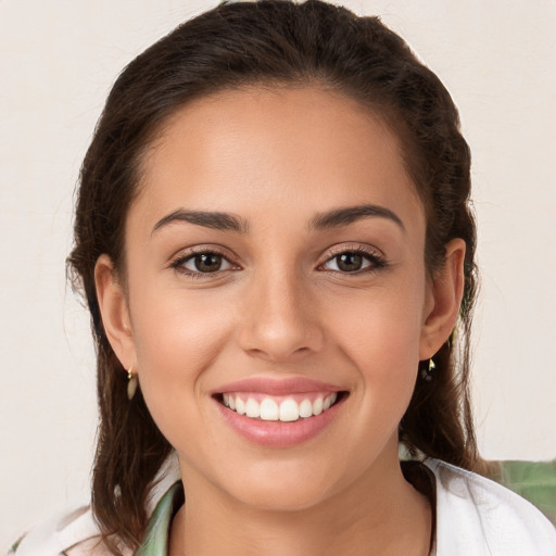 Joyful white young-adult female with medium  brown hair and brown eyes