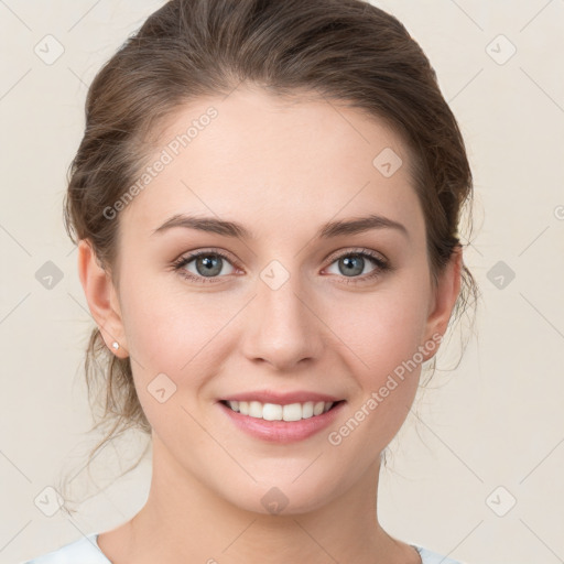 Joyful white young-adult female with medium  brown hair and green eyes