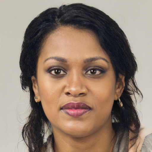 Joyful latino young-adult female with medium  black hair and brown eyes