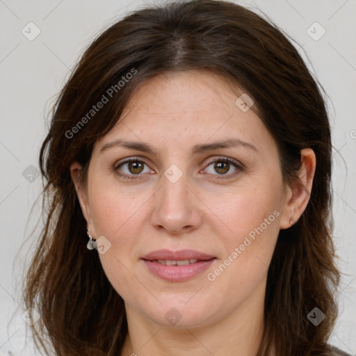 Joyful white adult female with long  brown hair and grey eyes