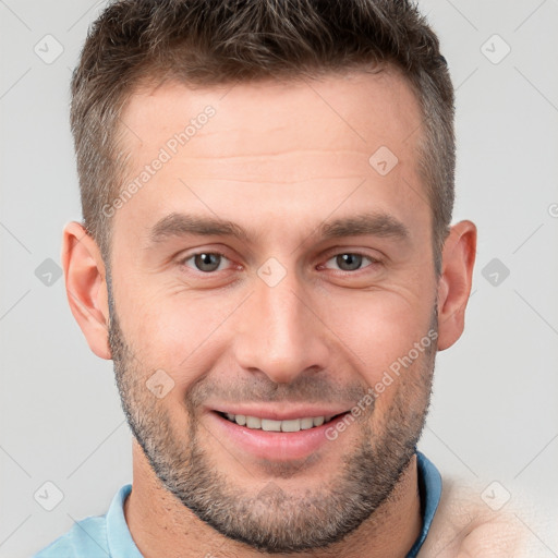 Joyful white adult male with short  brown hair and brown eyes