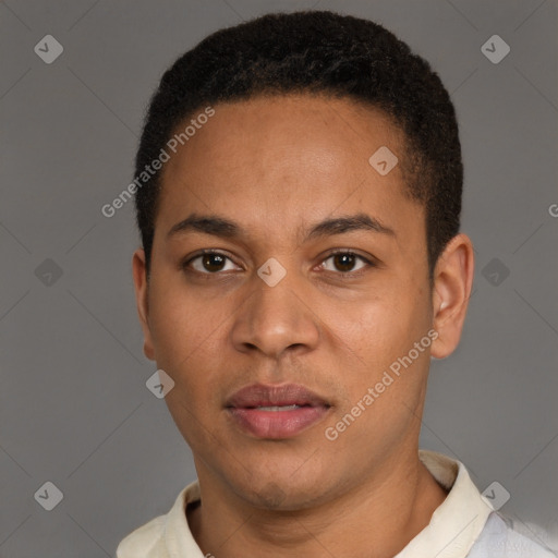 Joyful latino young-adult male with short  brown hair and brown eyes