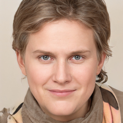 Joyful white young-adult female with medium  brown hair and blue eyes