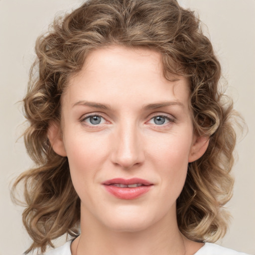 Joyful white young-adult female with medium  brown hair and green eyes