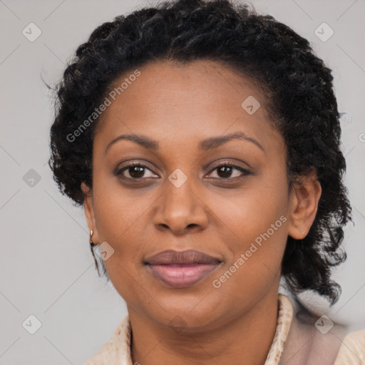 Joyful black adult female with short  brown hair and brown eyes