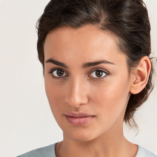 Neutral white young-adult female with medium  brown hair and brown eyes