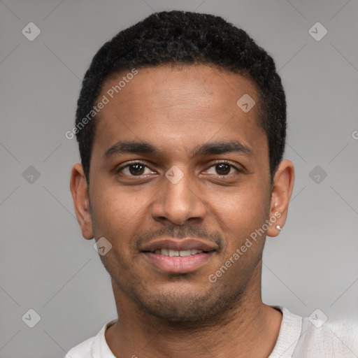 Joyful black young-adult male with short  black hair and brown eyes