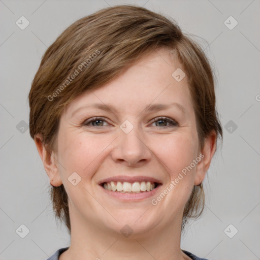 Joyful white young-adult female with medium  brown hair and grey eyes