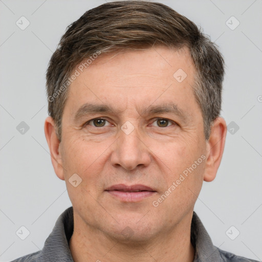 Joyful white adult male with short  brown hair and brown eyes