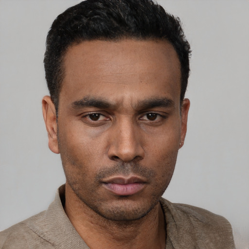 Neutral latino young-adult male with short  black hair and brown eyes
