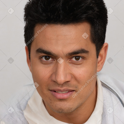 Joyful white young-adult male with short  black hair and brown eyes