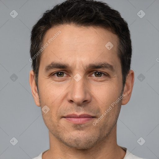 Joyful white adult male with short  brown hair and brown eyes