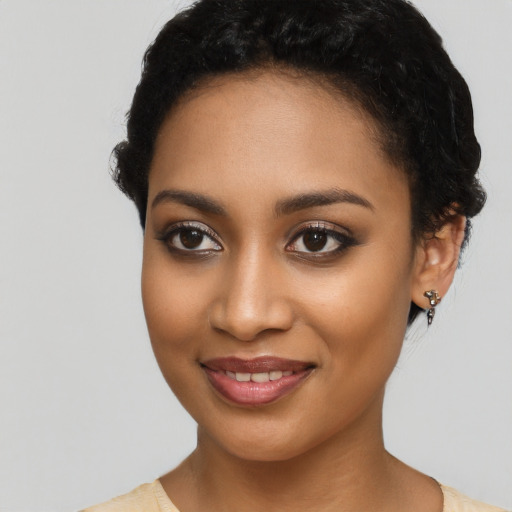 Joyful latino young-adult female with short  black hair and brown eyes