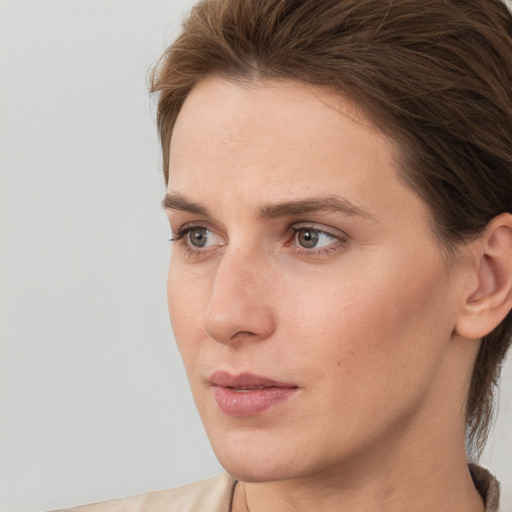 Neutral white young-adult female with medium  brown hair and grey eyes