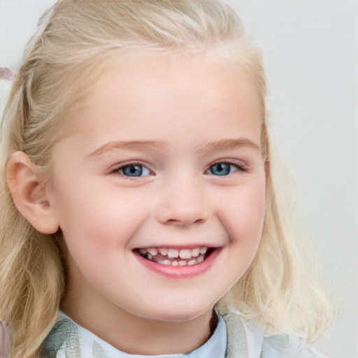 Joyful white child female with medium  blond hair and blue eyes