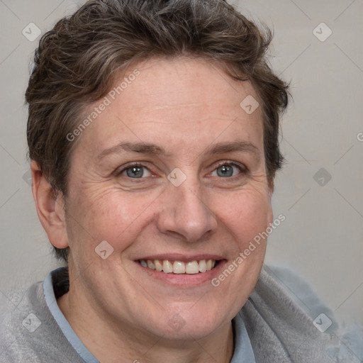 Joyful white adult female with short  brown hair and brown eyes