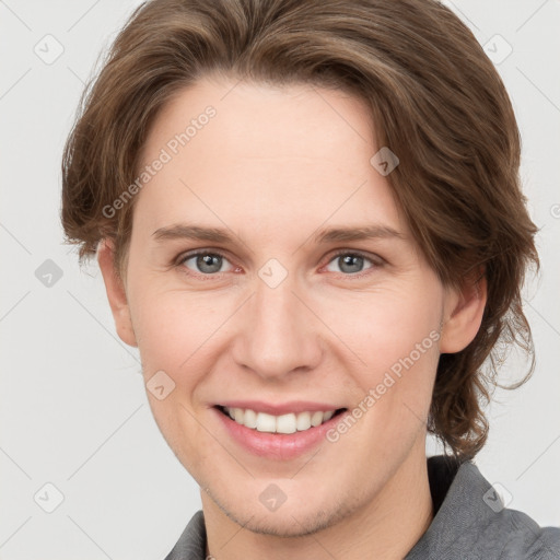 Joyful white young-adult female with short  brown hair and grey eyes