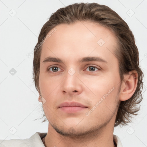 Neutral white young-adult male with short  brown hair and brown eyes